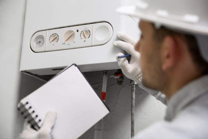 worker-repairing-water-heater (1)